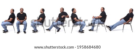 same man sitting on chair,various poses on white background Royalty-Free Stock Photo #1958684680