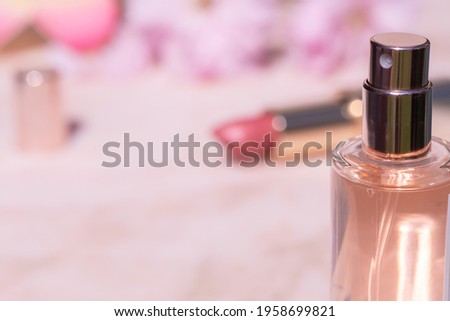 Beauty products on pink marble background