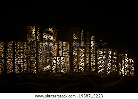 Cartoon style city buildings. Realistic city building miniatures with lights. background. Decorative city. Selective focus