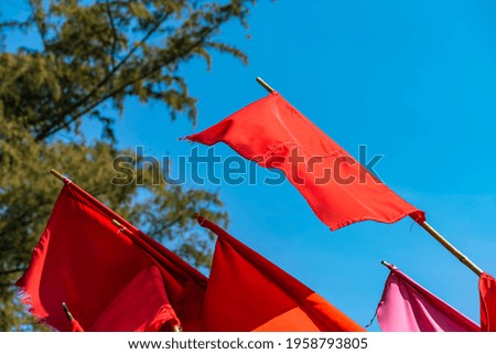 Local fishermen red flags, symbolize of crab boat a in Thailand with blue sky