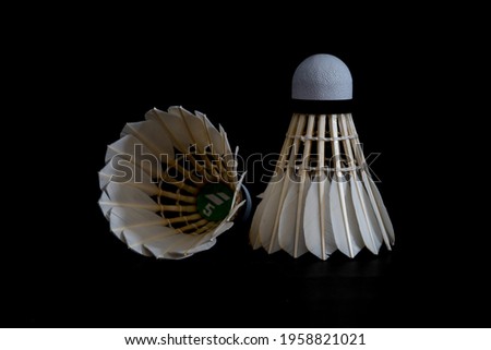 Still life concept badminton shuttlecock feather professional on isolated black background. 