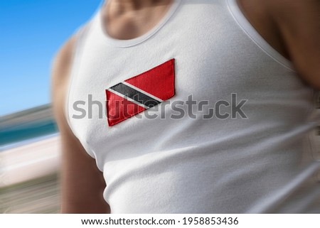 The national flag of Trinidad and Tobago on the athlete's chest