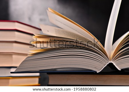 Composition with open book on the table. Royalty-Free Stock Photo #1958880802