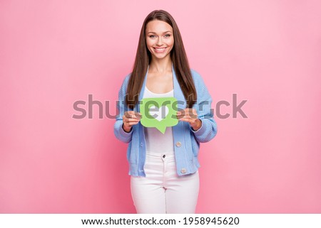 Photo of happy cheerful attractive girl hold hands like icon wear casual outfit isolated on pastel pink color background