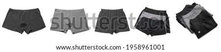 Set of stylish male trunks on white background Royalty-Free Stock Photo #1958961001