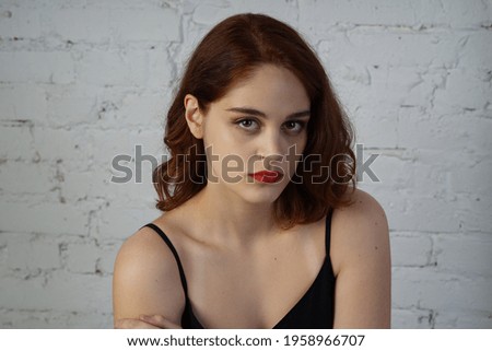 Photo of a young beautiful girl in a photo studio