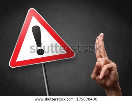 Happy cheerful smiley fingers looking at triangle warning sign with exclamation mark