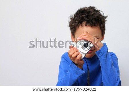 child holding camera with white background stock photo