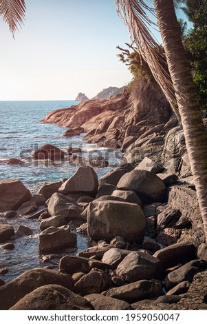 Rocky coast of the Andaman Sea, Thailand. Vertical image. Seascape.