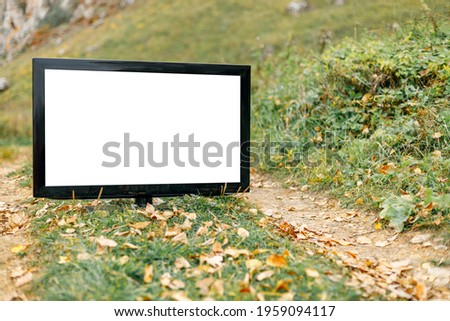 mocap from the TV screen for the inscription, the TV is located on a dirt road in the autumn
