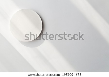 Empty white product presentation podium with trendy shadows. Abstract minimal empty stage. Cosmetic, package, mockup.