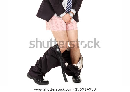 Man with the pants down holding his crotch isolated on white background Royalty-Free Stock Photo #195914933