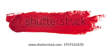 A red smear of lipstick isolated on a white background. Artistic design.Detail for design. Design elements. Macro.  Background for business cards, postcards and posters.