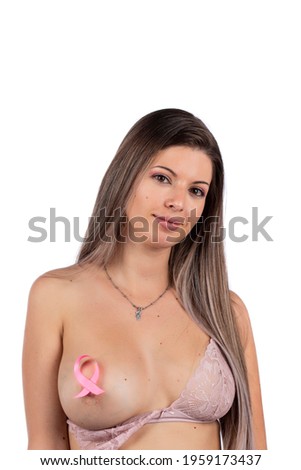 Caucasian girl with breast cancer ribbon wearing pink bra.