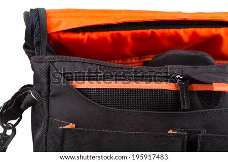 Close up view of open camera bag, isolated on white background.