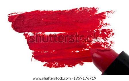 A red smear of lipstick isolated on a white background. Artistic design.Detail for design. Design elements. Macro.  Background for business cards, postcards and posters.