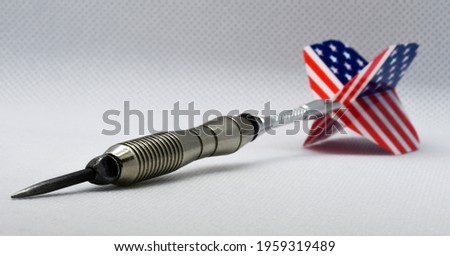 Steel tip dart with United States flag. Success and precision concept.