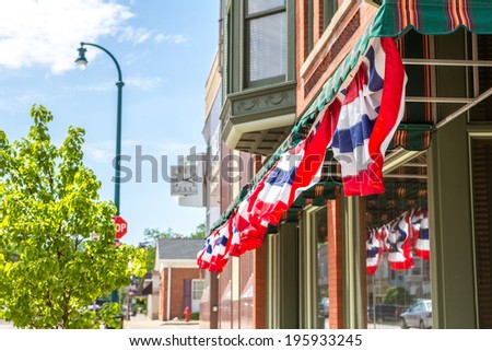 Patriotic  bunting on a business in a small town, shallow depth 