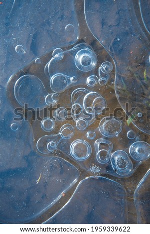 Ice structure with air circles. Natural abstract knot, blue tones