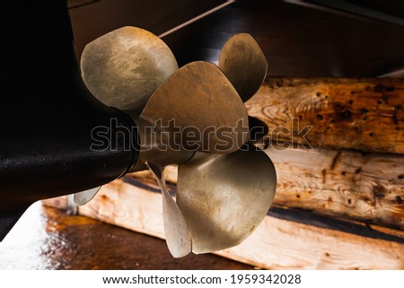 Azimuth twin-screw motor on a motor boat, bottom view. The bottom of a motor boat with azimuth motors with a double row of propellers. Royalty-Free Stock Photo #1959342028