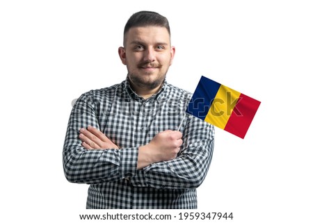 White guy holding a flag of Chad smiling confident with crossed arms isolated on a white background.