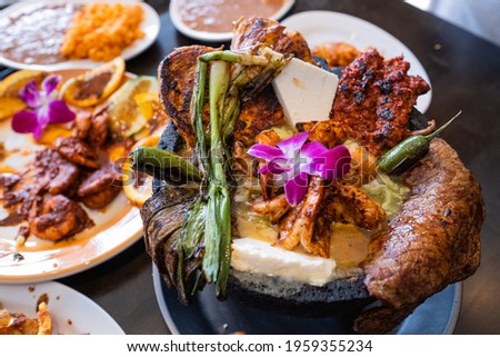Molcajete of meat and shrimp Royalty-Free Stock Photo #1959355234