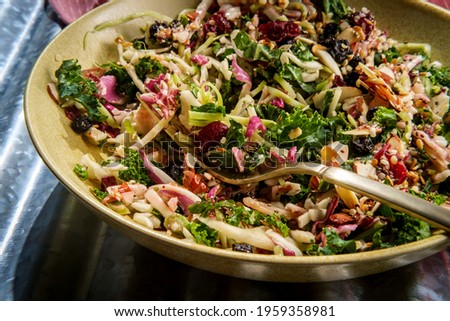 Chopped superfood salad with raspberry acai dressing topped with hemp chia and flax seeds Royalty-Free Stock Photo #1959358981