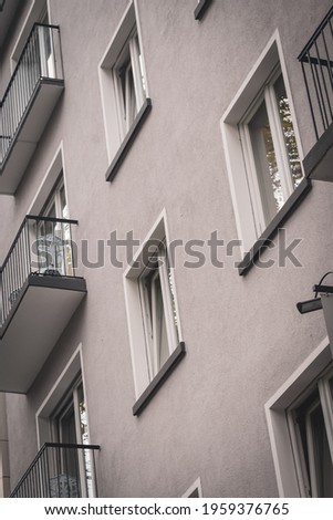 the windows of an apartment building in the city center