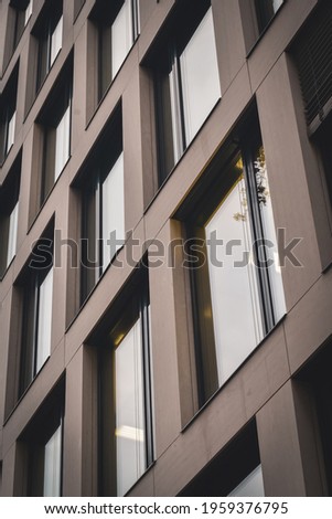 the windows of an apartment building in the city center