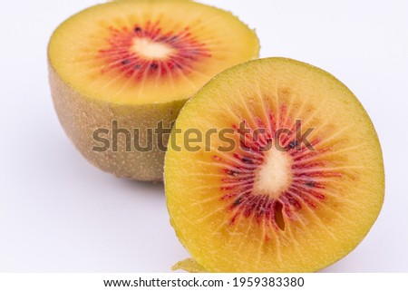 close-up view of fresh red kiwi fruit isolated on white background.