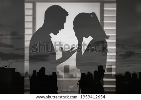 Husband screaming a wife. Bad relationship, and domestic abuse concept.  Royalty-Free Stock Photo #1959412654