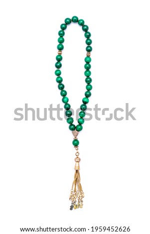 Muslim prayer rosary beads isolated on white background. Royalty-Free Stock Photo #1959452626