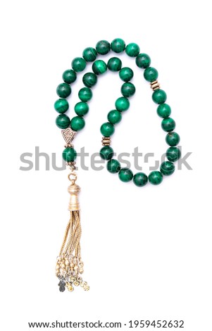 Muslim prayer rosary beads isolated on white background. Royalty-Free Stock Photo #1959452632