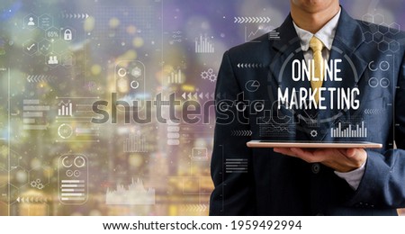 businessman holding a tablet computer online marketing icon graph abstract backgrounds with bokeh. abstract backgrounds with bokeh.