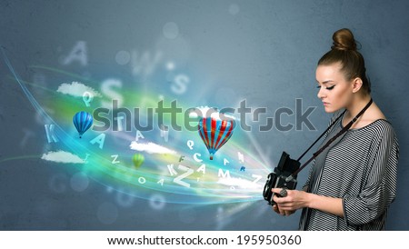 Cute photographer girl with camera and abstract imaginary