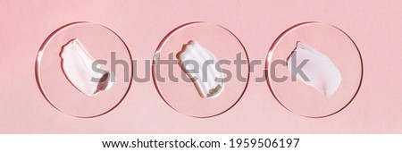 White cream texture on a pink background. Royalty-Free Stock Photo #1959506197