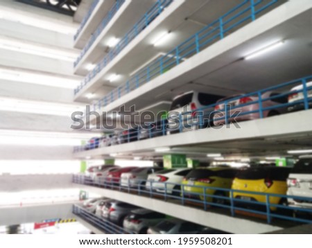 Dark perils in unexpected places. Indoor parking in supermarket, blurred background.