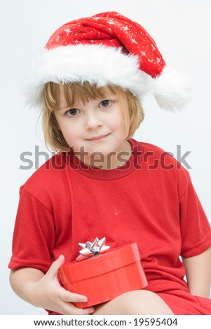 Christmas kid in Santa hat on white background