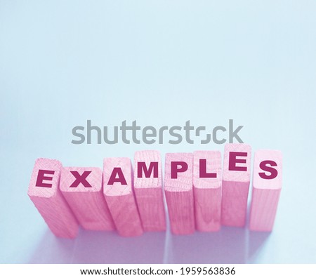 Examples word written on wooden blocks. Education or storytelling marketing concept.