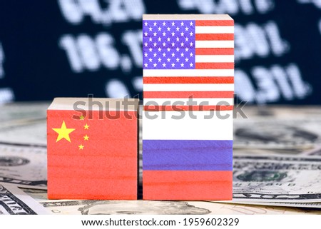 Dollars and flags of China, Russia and USA