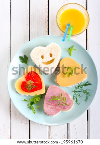 Heart shaped sandwiches on plate Royalty-Free Stock Photo #195961670