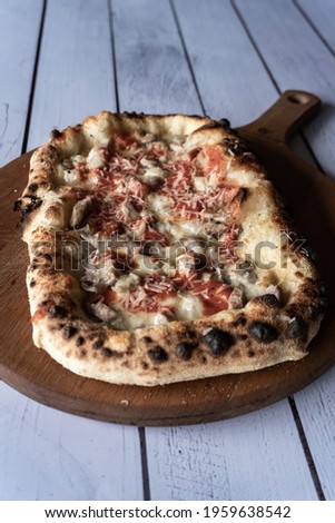 Pizza with pork, mozzarella and tomato sauce. Italian style pizza.