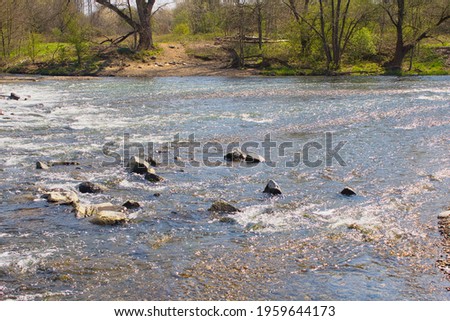 View of a fast flowing part of the river Agger in Troisdorf, Germany. Background and nature photo