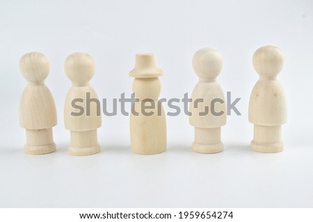 Group of people wooden figure isolated. Leadership concept.Selective focus image
