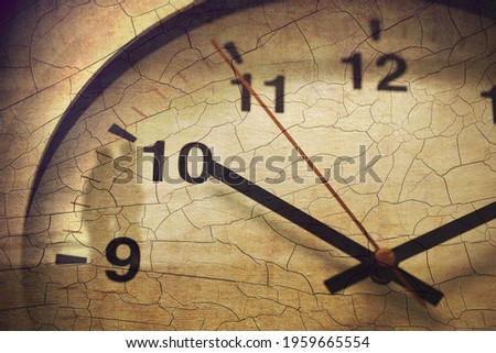Old times death or perpetual time, pass away history periods antique retro concept, cracked grunge texture overlay wall clock closeup.