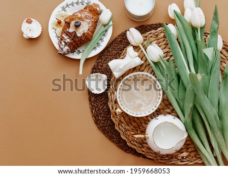 Coffee cup and bouquet of white tulips . Concept of holiday, birthday, Women Day. Romantic Feminine flat lay. Good morning. still life. 