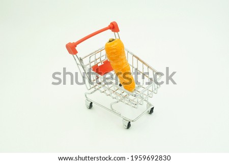 carrots in a mini basket on a white background