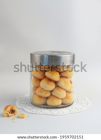 Nastar Cookies, Pineapple tarts or nanas tart are small, bite-size pastries filled or topped with pineapple jam, commonly found when Hari Raya or Eid Al Fitr or Lebaran. Selective focus. Royalty-Free Stock Photo #1959702151
