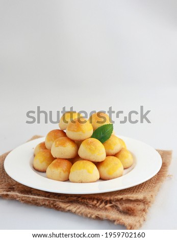 Nastar Cookies, Pineapple tarts or nanas tart are small, bite-size pastries filled or topped with pineapple jam, commonly found when Hari Raya or Eid Al Fitr or Lebaran. Selective focus. Royalty-Free Stock Photo #1959702160