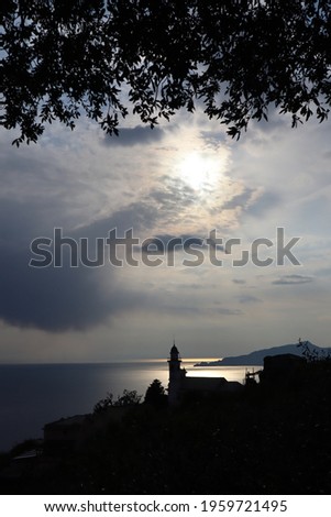 church silhouette in Liguria at sunset, Italy 